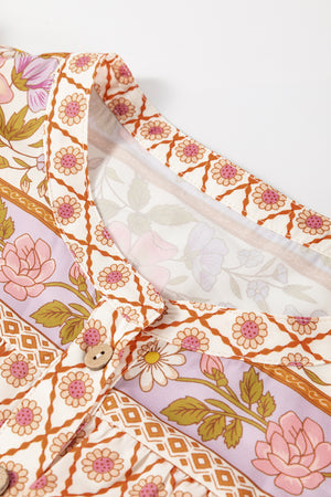 Bohemian floral print blouse with button front and blouson sleeves.