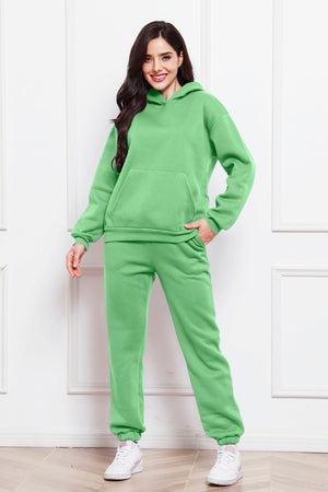 Mint green relaxed hoodie and joggers set with front pocket and drawstring waist.