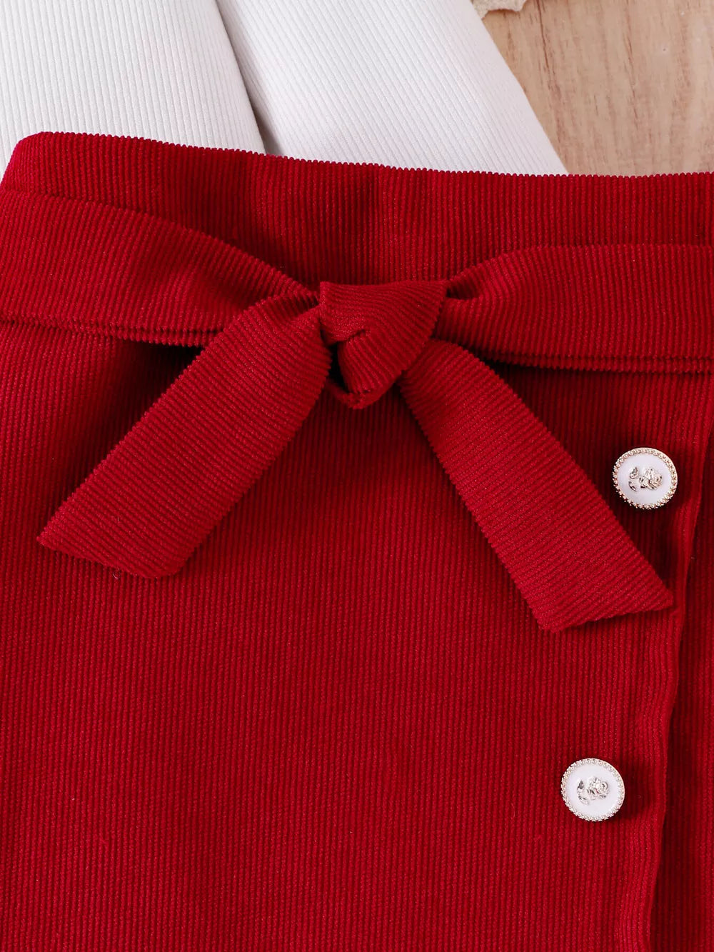Children's Bow Long Sleeve Top And Skirt Set in White, model styling view