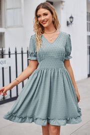 Teal textured dot puff sleeve fit-and-flare dress with ruffled hem and V-neck