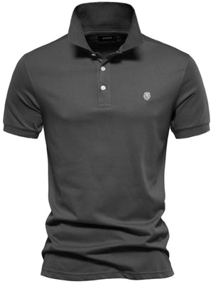 Gray cotton polo shirt with embroidered crest detail and button placket.