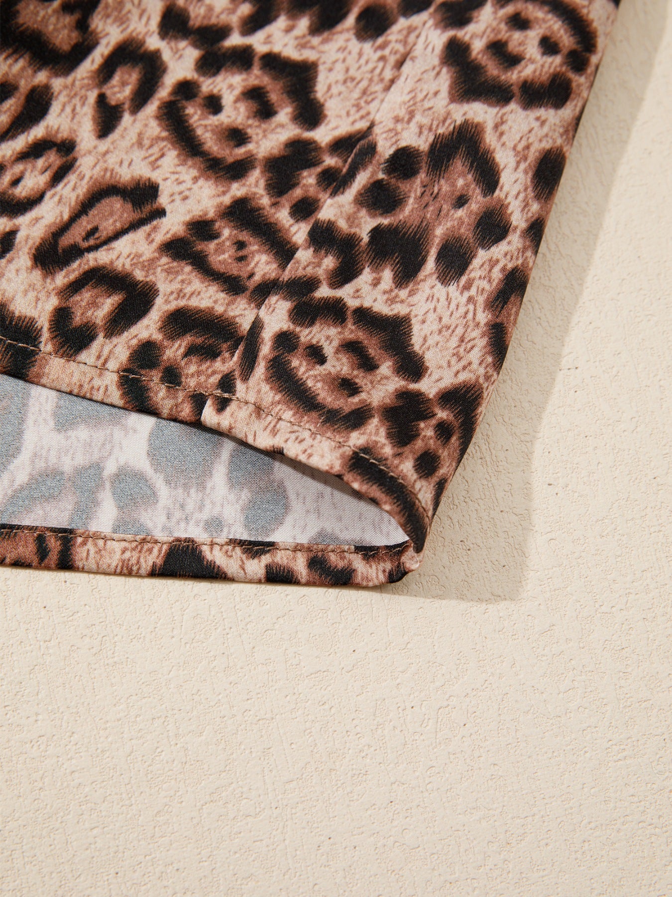 Leopard print blouse with puff sleeves and bow tie detail
