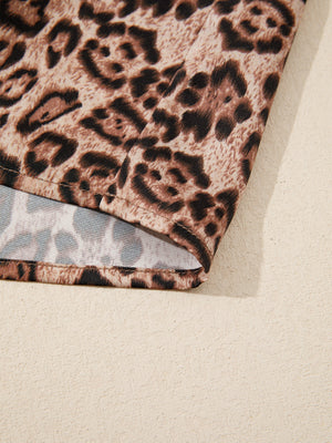 Leopard print blouse with puff sleeves and bow tie detail