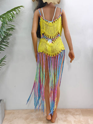 Yellow crochet cover-up dress with rainbow fringe and intricate knit details.