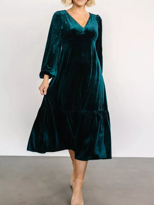 Peacock blue velvet midi dress with tiered skirt, V-neck, long sleeves.