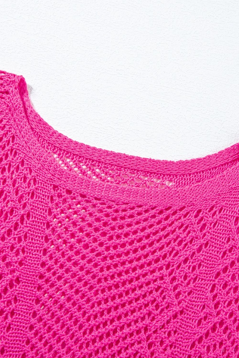 Hot pink open-knit chevron sleeve top with a crew neck.
