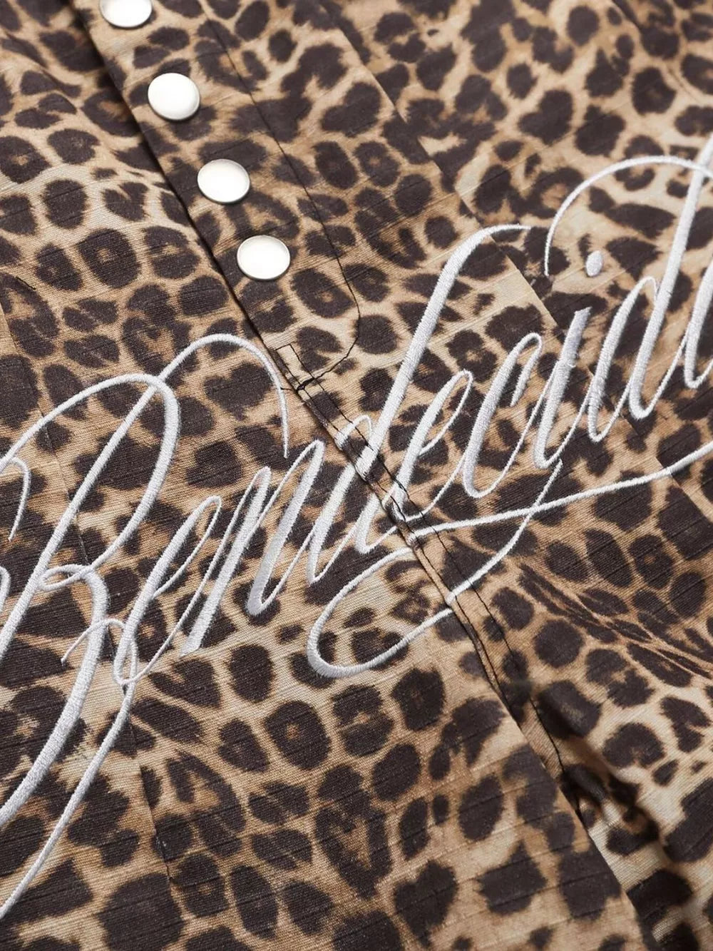 Men's leopard print cargo sweatpants with white embroidered logo detail and snap buttons.