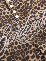 Men's leopard print cargo sweatpants with white embroidered logo detail and snap buttons.