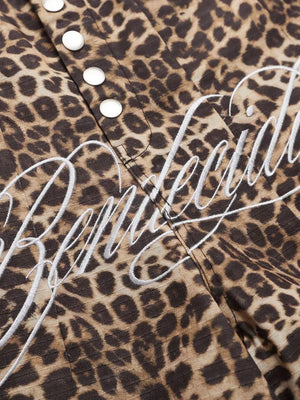 Men's leopard print cargo sweatpants with white embroidered logo detail and snap buttons.