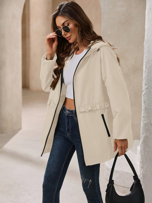 Cream hooded windbreaker jacket with ruffled waistline and black trim