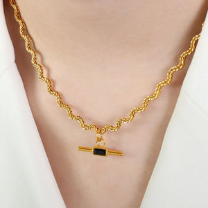 Gold rope chain necklace with black bar pendant