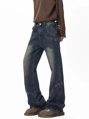 Men's vintage wash wide leg jeans in dark blue denim with distressed details.