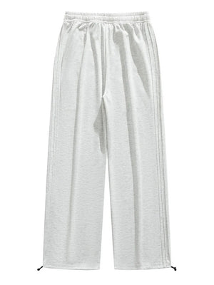 Lightweight wide-leg men's sweatpants in light gray with drawstring and side stripe detail.