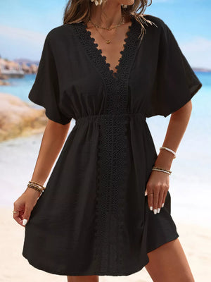 Black V-neck cover-up dress with lace trim and short sleeves.