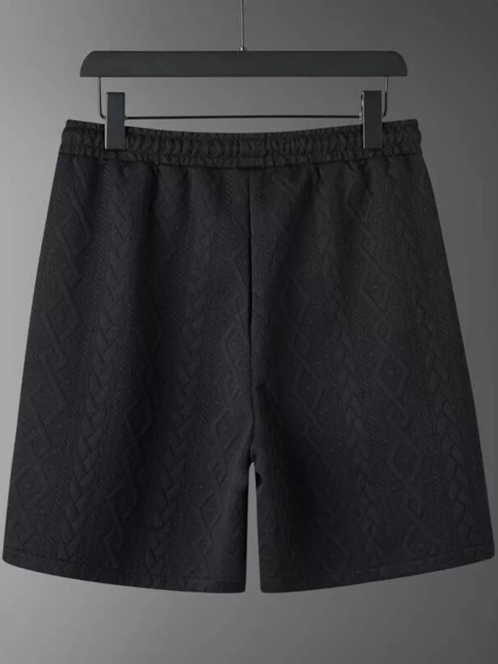 Black knit shorts with diamond pattern and elastic waistband