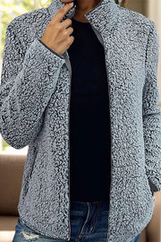 Teddy fleece zip-up jacket in dark gray with a stand-up collar and zipper closure.