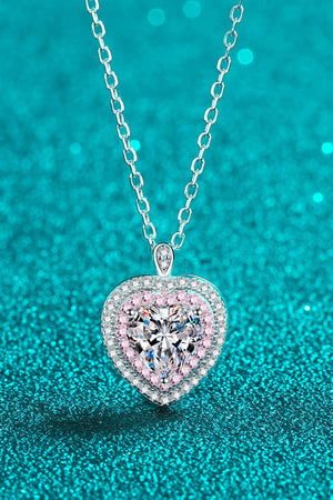 Silver heart halo moissanite pendant necklace with pink accent stones.