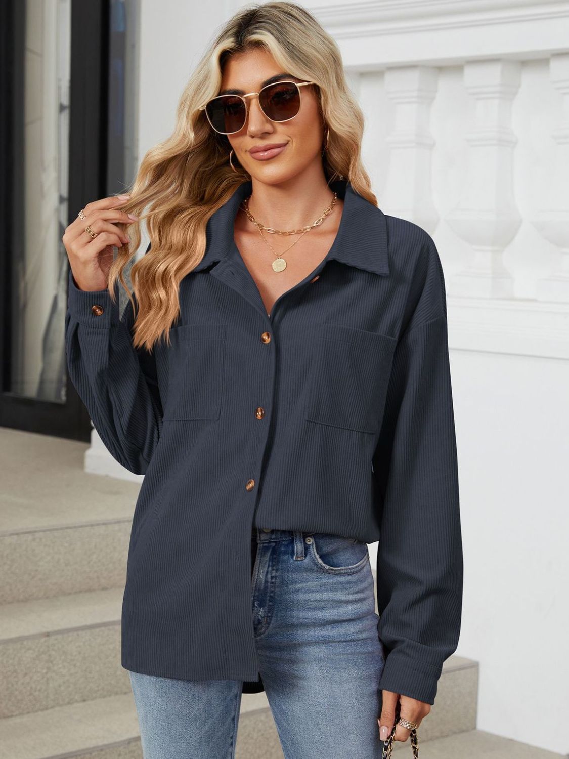 Dark Navy corduroy overshirt with buttoned patch pockets and long sleeves.