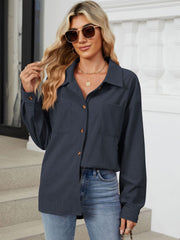 Dark Navy corduroy overshirt with buttoned patch pockets and long sleeves.