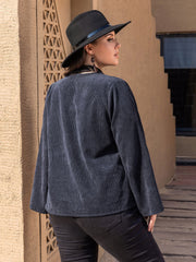 Dark navy corduroy open-front jacket with subtle leaf embroidery detail.