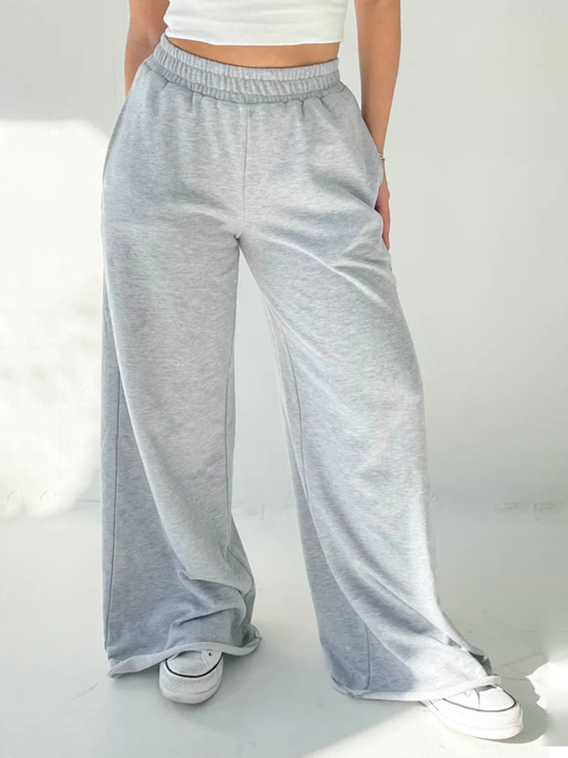 Light gray wide-leg lounge pants with elastic waistband and pockets