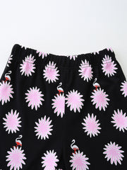 Black baby shorts with pink floral and flamingo print
