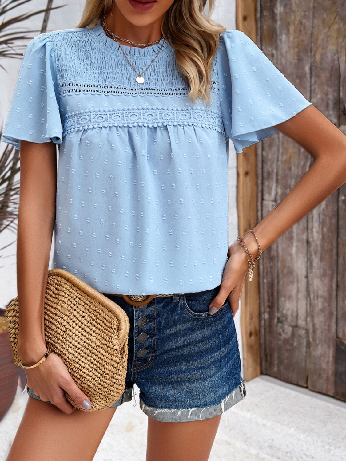 Light blue dotted swiss smocked bodice blouse with flutter sleeves and lace trim