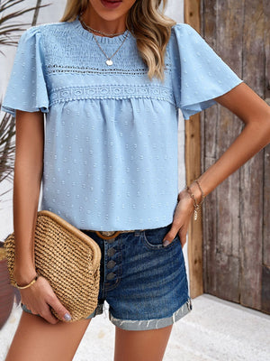 Light blue dotted swiss smocked bodice blouse with flutter sleeves and lace trim