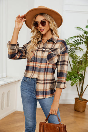 Soft plaid overshirt with patch pockets and button front, in a tan, navy, and rust plaid pattern.