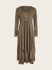 Coffee tiered midi dress with long sleeves, ruched bust, and heart detail.