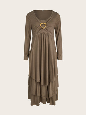 Coffee tiered midi dress with long sleeves, ruched bust, and heart detail.