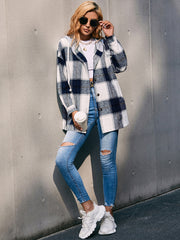 Oversized plaid shacket with hood in dark blue and white, featuring a casual, relaxed fit.
