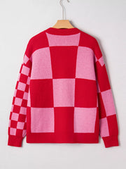 Checkerboard knit cardigan in deep rose and pink with a crew neck.