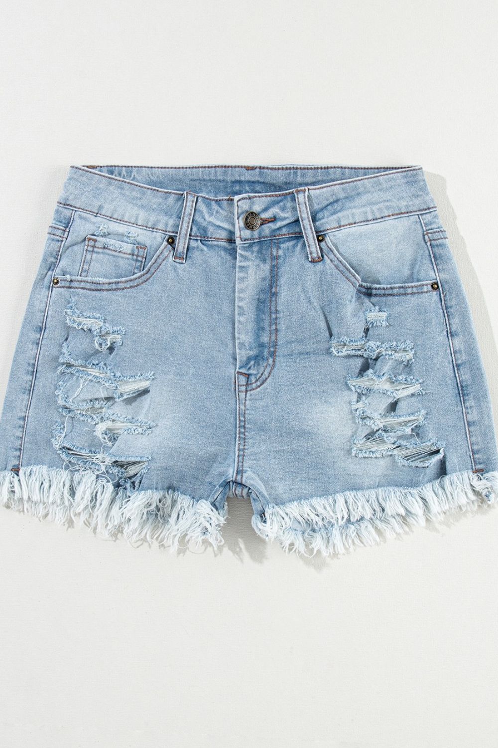 Light blue distressed denim cutoff shorts with frayed hem