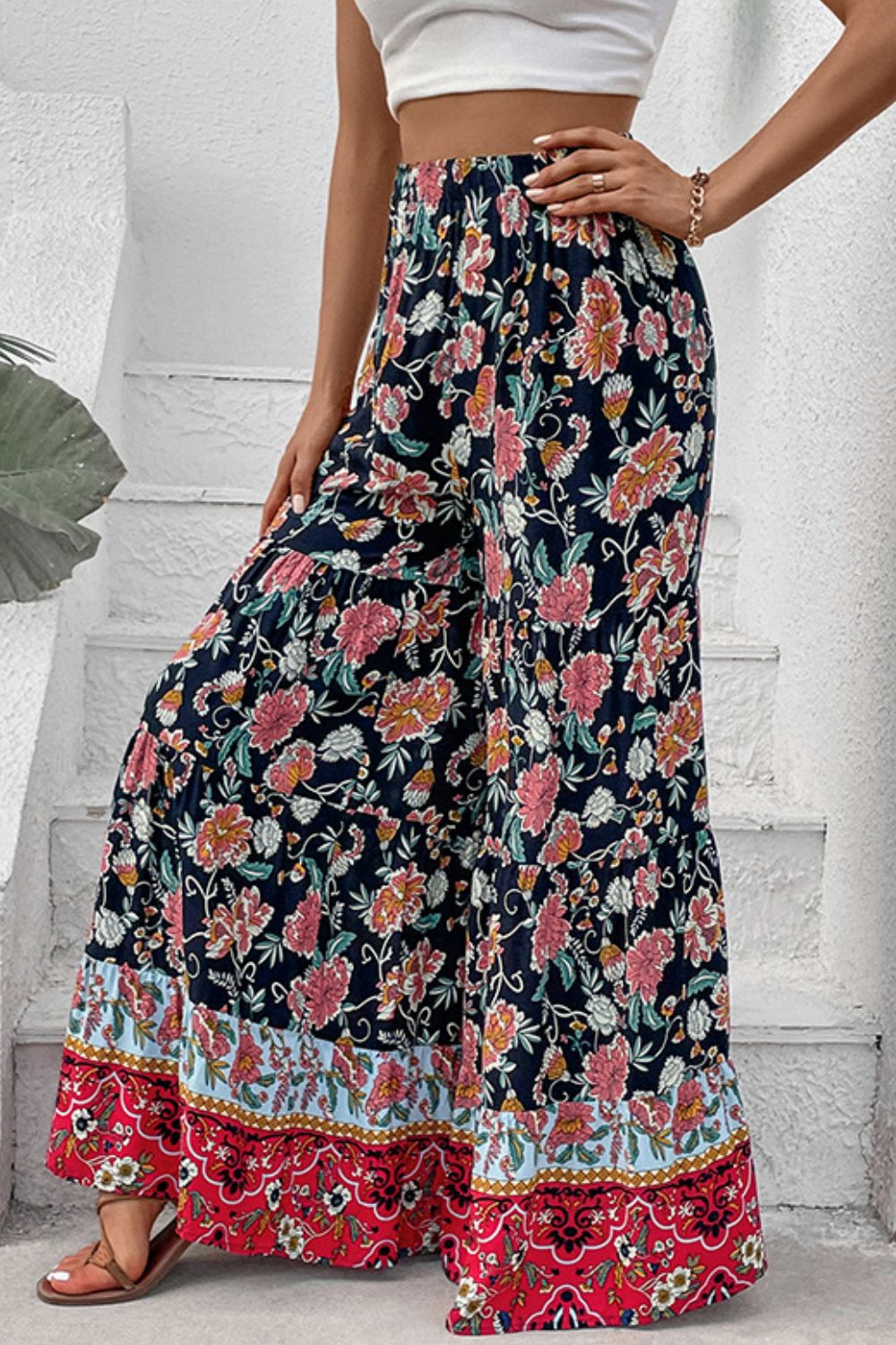 Floral border palazzo trousers with a tiered hem and wide leg.
