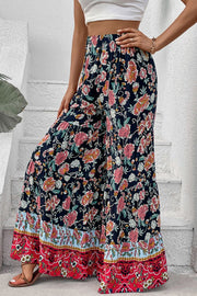 Floral border palazzo trousers with a tiered hem and wide leg.