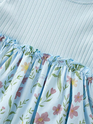Baby dress with light blue ribbed knit top and floral print skirt with ruffles.