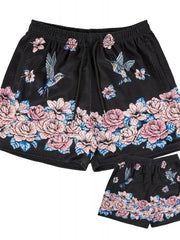 Black mesh athletic shorts with floral and hummingbird print