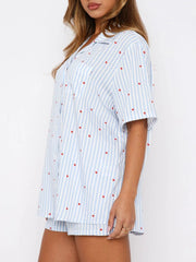 Light blue striped pajama set with red hearts, collared button-up top and shorts.