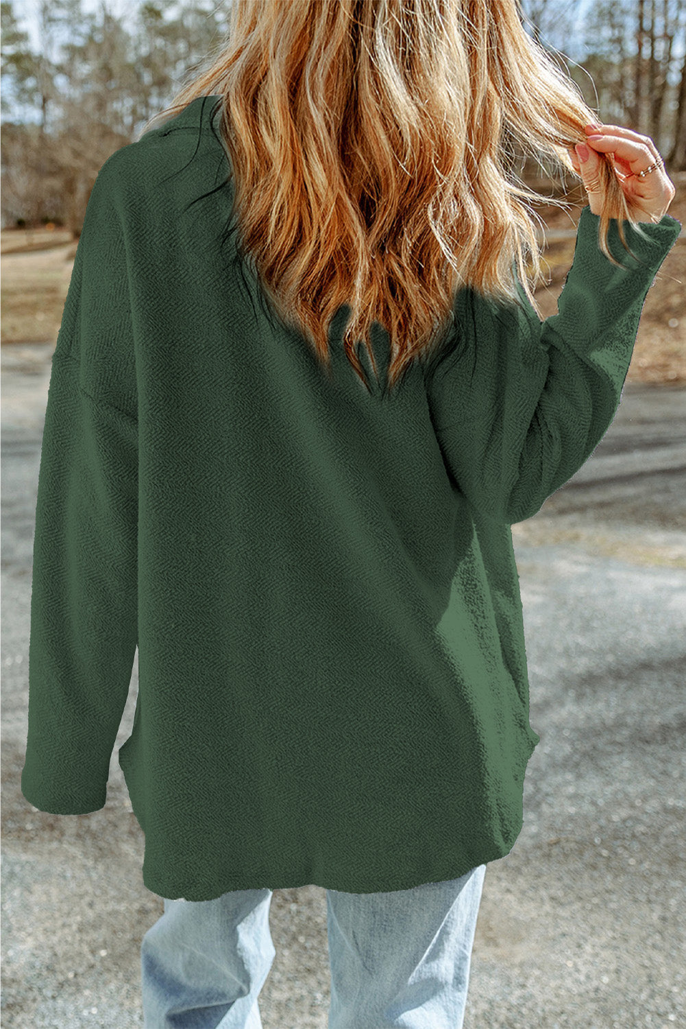Dark green textured shacket with raw-edge detailing and pockets.
