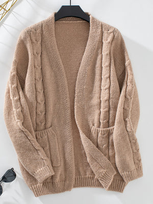 Tan cable knit open cardigan with pockets and long sleeves.