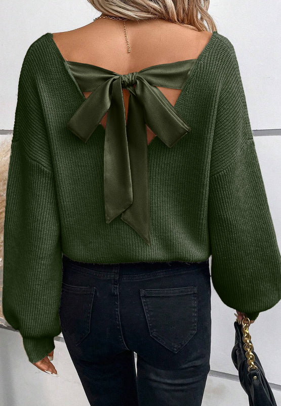 Dark green ribbed knit sweater with a satin bow back detail and balloon sleeves.