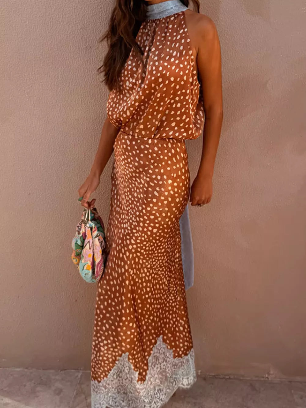 Brown polka dot maxi skirt with white lace trim, high neck halter top.