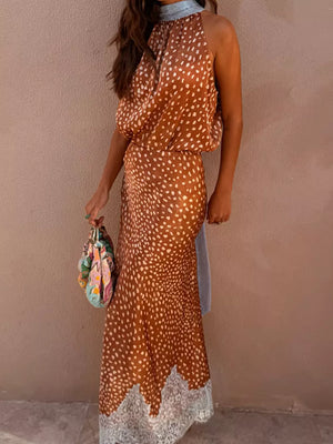 Brown polka dot maxi skirt with white lace trim, high neck halter top.