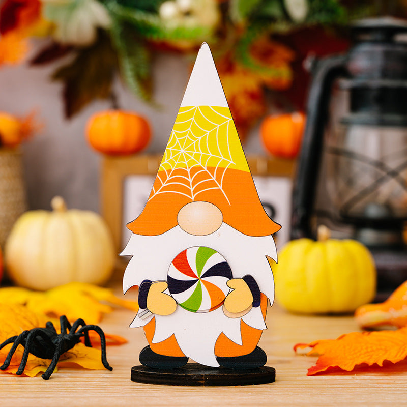 Halloween gnome decoration Style A holding a colorful lollipop, with spiderweb hat.