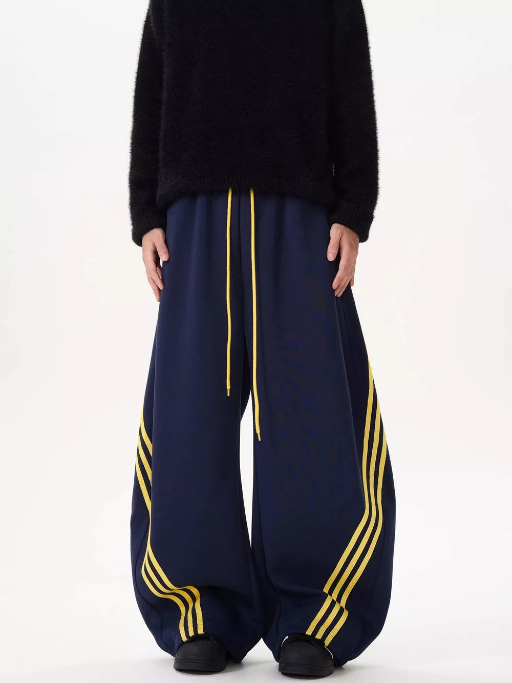 Navy wide-leg sweatpants with yellow stripes and drawstring waist