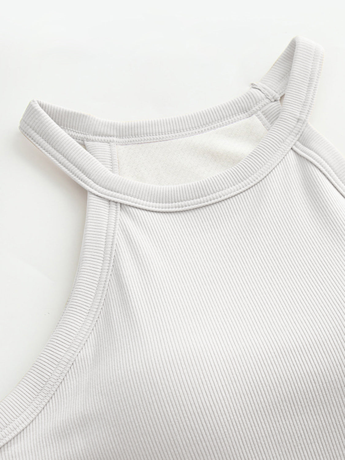 Gray ribbed halter tank top with built-in bra detail and contrast stitching.