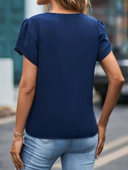 Dark blue lace trim flutter sleeve blouse with a round neckline.