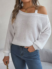 White one-shoulder knit sweater with buckle detail and waffle texture.