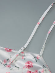 White floral print midi dress with adjustable spaghetti straps and a satin finish.